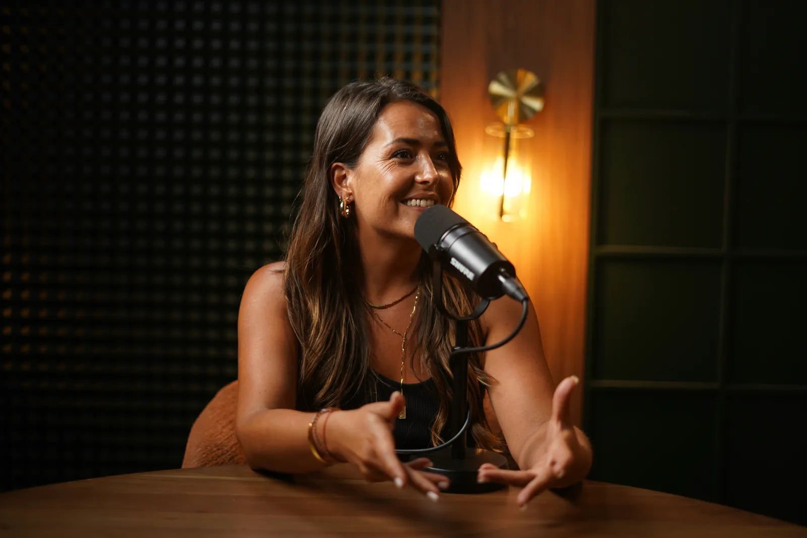 Content creator at the mic in Recordia's Cigar Lounge studio