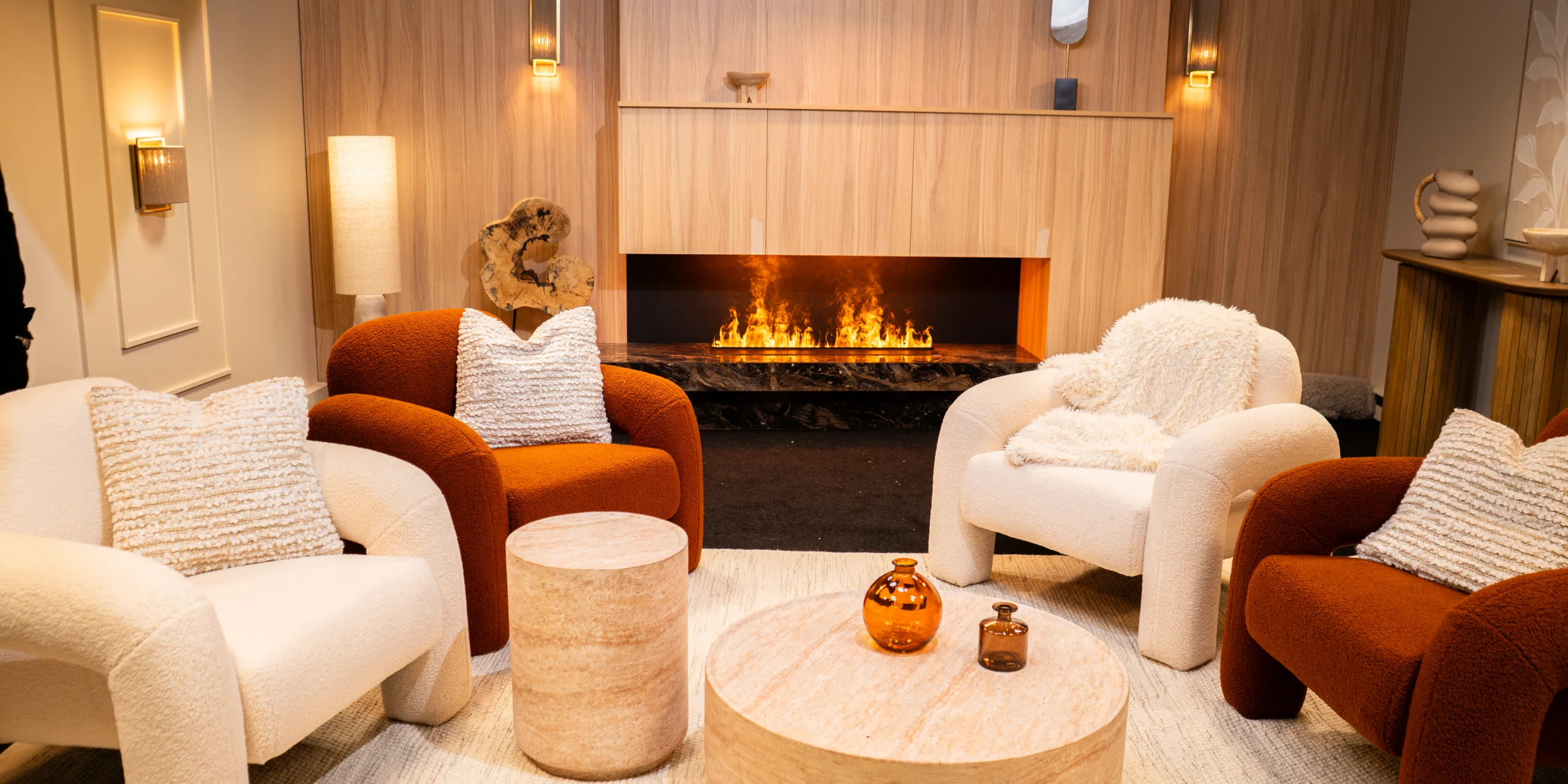 Recordia's Cosy Cream studio: fireplace, cream and terracotta bouclé armchairs